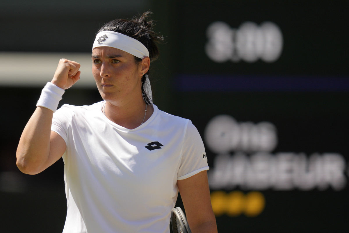 Ons Jabeur celebrates after advancing at Wimbledon